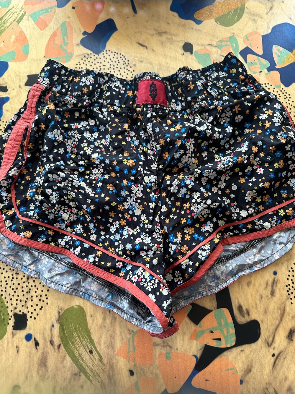 FP Movement by Free People Black Floral Athletic Shorts with Pink Trim